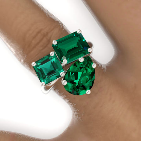 3 Carat Emerald Cut with Pear Cut Paired with 2 Carat Asscher Cut Emerald Three-Stone North-South Engagement Ring