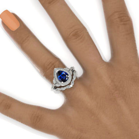 14K White Gold 1.5 Carat Pear Royal Blue Sapphire Halo Twisted Engagement Ring Eternity Ring Set